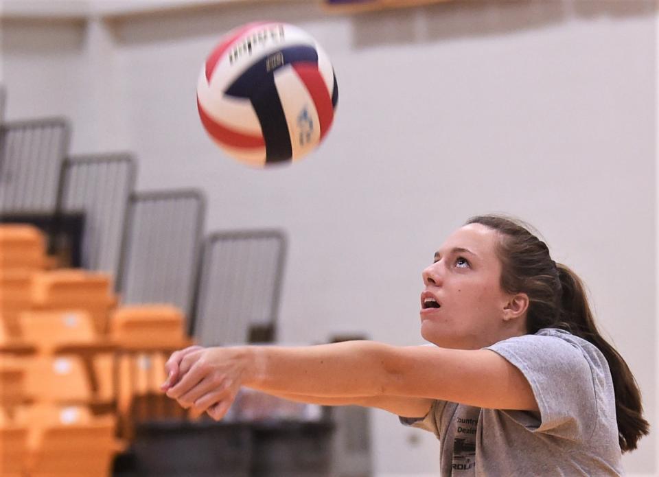 Moran grad Johnnie Hise eyes the ball as she makes a pass during practice with the North squad on Wednesday at Wylie's Bulldog Gym.