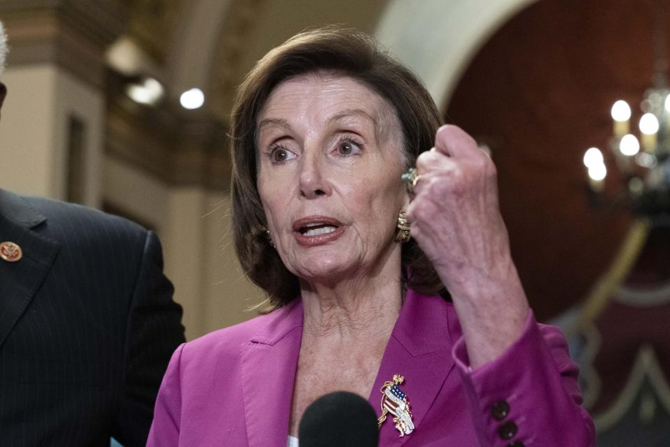 FILe - Speaker of the House Nancy Pelosi, D-Calif., talks to reporters after day of delays in the vote to advance President Joe Biden's domestic policy package, at the Capitol in Washington, on Nov. 5, 2021. Democrats’ $1.85 trillion package of social and climate initiatives seems afflicted by a maddening parade of hurdles. Looming ahead is the Congressional Budget Office, which could cause problems that would be messy but probably surmountable. (AP Photo/Jose Luis Magana, File)