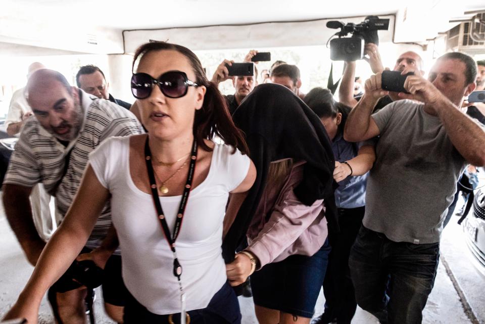 This picture taken on July 29, 2019 shows a British teenager who accused seven Israelis of gang rape arriving at the Famagusta District Court in Paralimni in eastern Cyprus, to face charges of making a false allegation. - Initially, the 19-year-old woman had alleged that 12 Israelis gang raped her at the hotel where she was staying in the popular Ayia Napa resort on July 17. The young Israeli tourists were remanded in custody the next day. But hours before their second appearance in court five of them were released and sent home late the next day. (Photo by Iakovos Hatzistavrou / AFP)        (Photo credit should read IAKOVOS HATZISTAVROU/AFP/Getty Images)