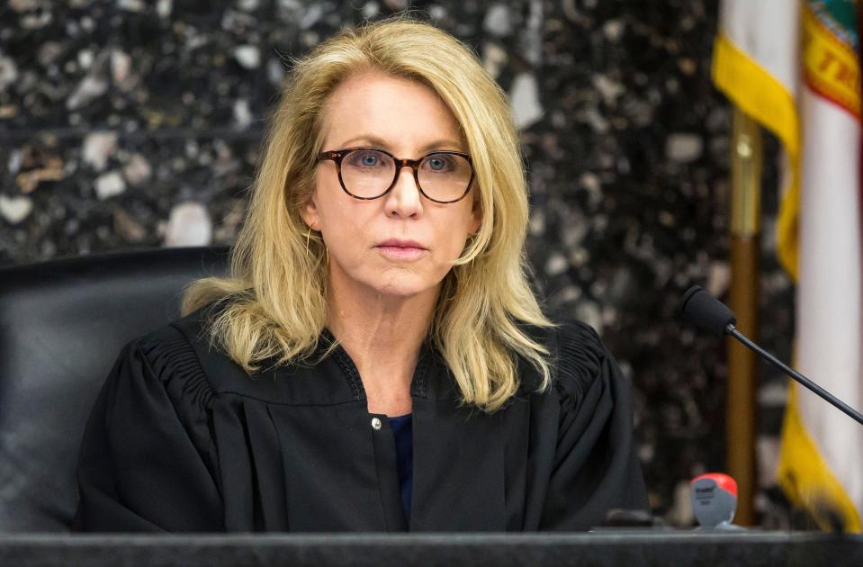 Circuit Judge Laura Johnson sits atop the bench in a West Palm Beach courtroom on April 5, 2019. Johnson retired June 9, 2023.