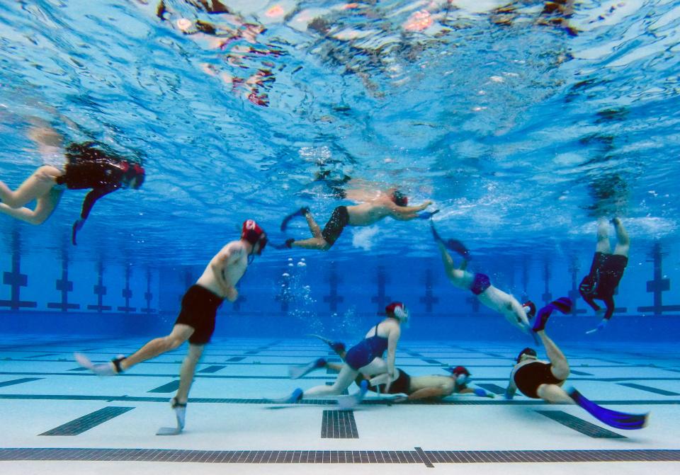 The Evansville Penguins Underwater Hockey club scrimmage during practice at the Deaconess Aquatic Center in Evansville, Ind., Thursday, Sept. 21, 2023.