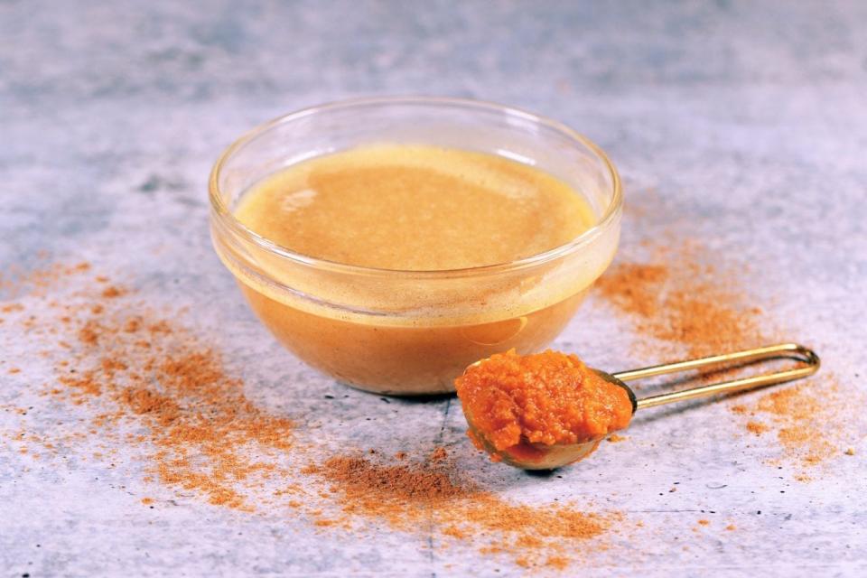 White chocolate-style pumpkin sauce in glass bowl.