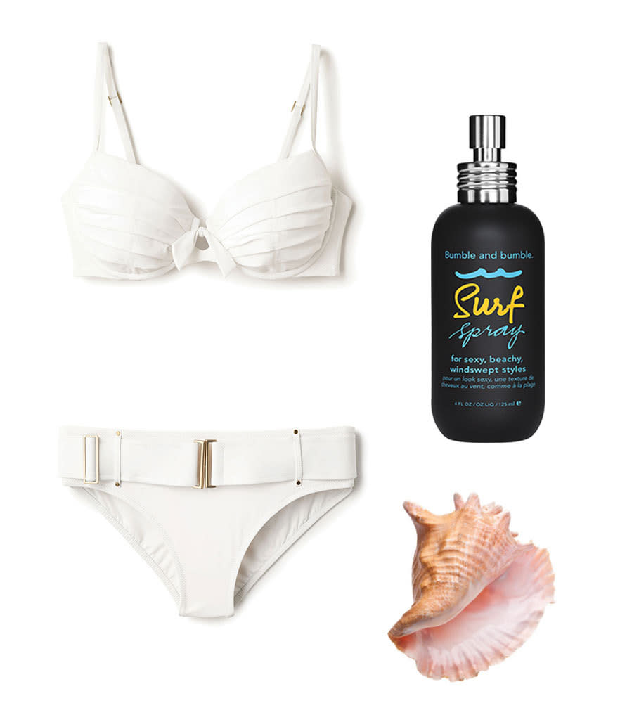 Keep it simple — a belted white bikini and some sea-salt spray are all you need to channel Honey Ryder.
