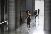 A model wears a creation as part of the Bottega Veneta Spring-Summer 2020 collection, unveiled during the fashion week, in Milan, Italy, Thursday, Sept. 19, 2019. (AP Photo/Antonio Calanni)