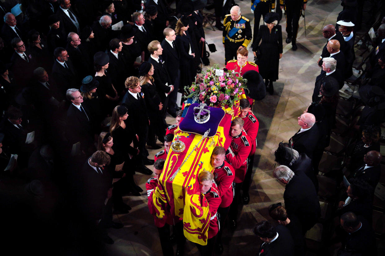 King Charles III and the Queen Consort follow behind the coffin of Queen Elizabeth II as it is carried into St George's Chapel in Windsor Castle, Berkshire for her Committal Service. Picture date: Monday September 19, 2022.
