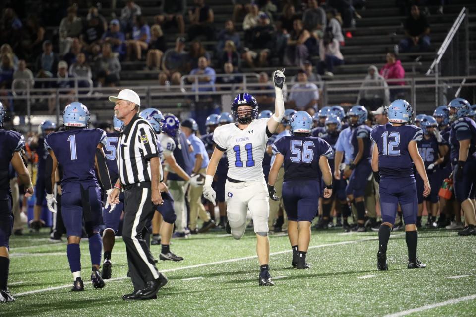 Quakertown senior defensive end Anthony Ferrugio (11) celebrates making a play in the Panthers' 38-17 win over North Penn.