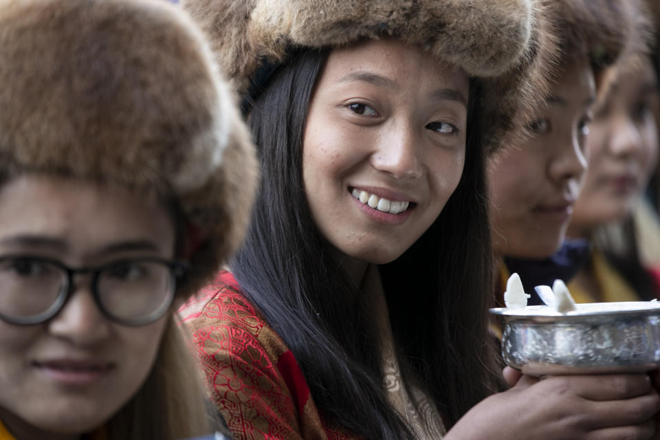 Friends and family members wait to receive the all-Nepalese mountaineering team that became the first to scale Mount K2 in winter as they arrive at Tribhuwan International airport in Kathmandu, Nepal, Tuesday, Jan. 26, 2021. (AP Photo/Niranjan Shrestha)