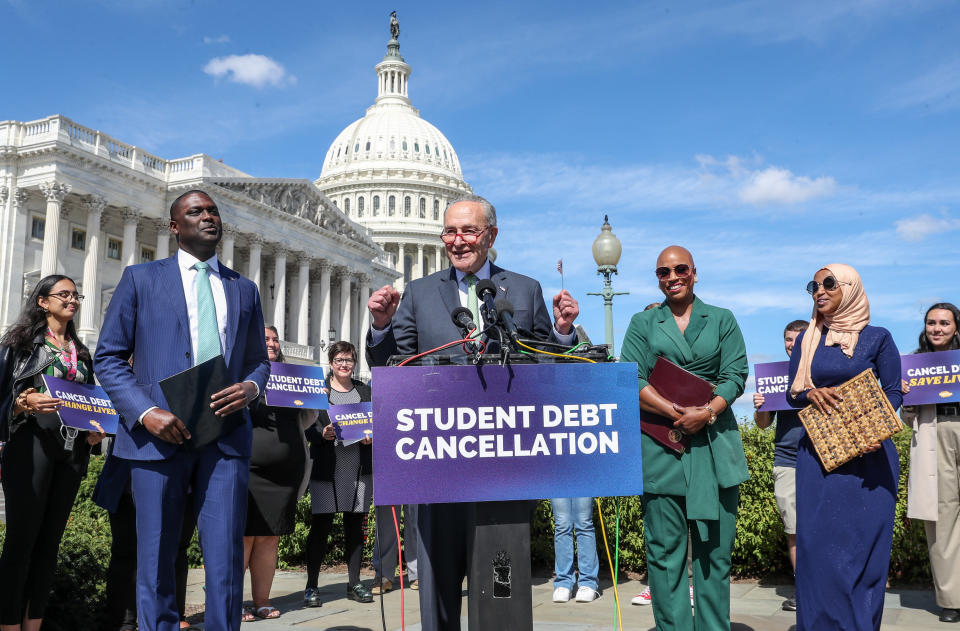 Senate Majority Leader Chuck Schumer celebrates President Joe Biden's cancellation of student debt on Capitol Hill, Sept. 29, 2022.