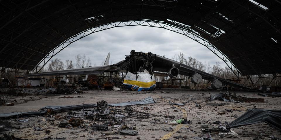 The destroyed Ukrainian Antonov An-225 "Mriya" cargo aircraft, which was the largest plane in the world, among the wreckage of Russian military vehicles at the Hostomel airfield on April 8, 2022 in Hostomel, Ukraine.