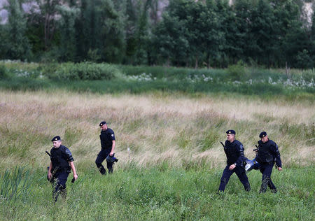 Croatia's riot police officers are seen next to the border with Bosnia and Herzegovina in Maljevac, Croatia, June 18, 2018. REUTERS/Antonio Bronic