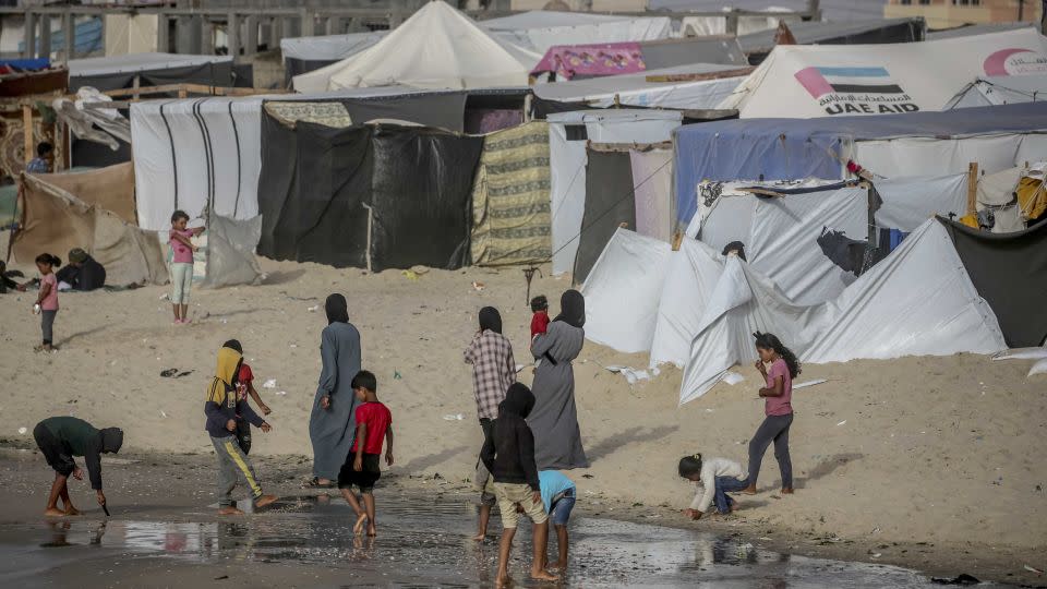 Palestinians jump into the water to cool off during hot weather in Rafah, Gaza on April 19, 2024. - Jehad Alshrafi/Anadolu/Getty Images