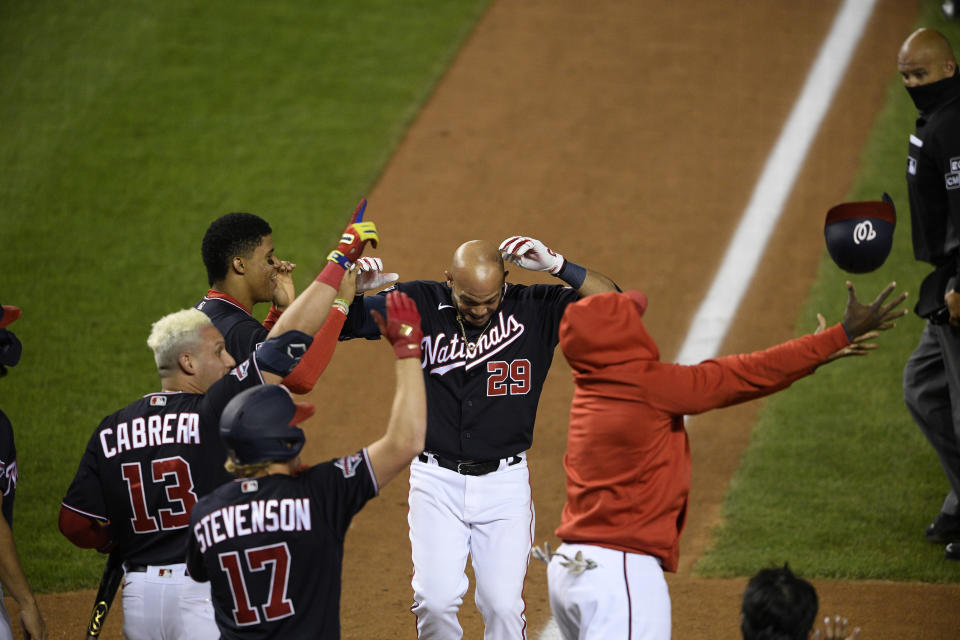 Washington Nationals' Yadiel Hernandez (29) celebrates his game-ending, two-run home run during the eighth inning of the second baseball game of the team's doubleheader against the Philadelphia Phillies, Tuesday, Sept. 22, 2020, in Washington. The Nationals won 8-7. (AP Photo/Nick Wass)