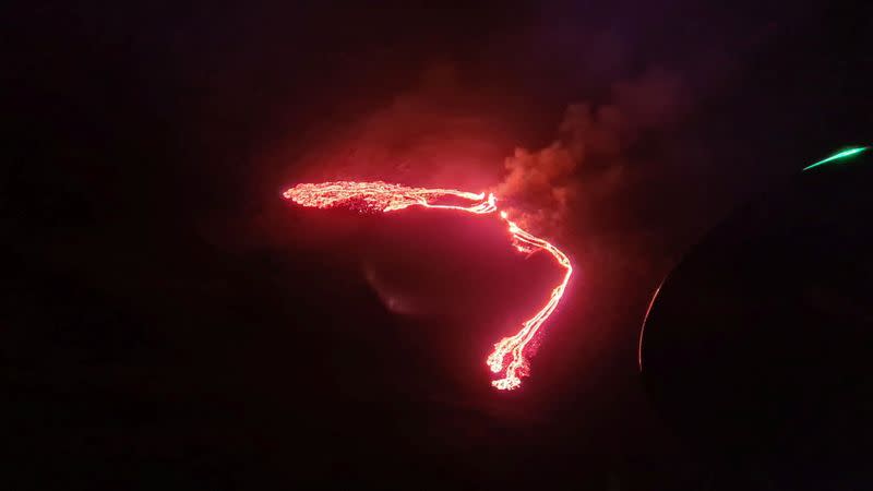 Lava streams are seen during a volcanic eruption in Fagradalsfjall