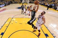 June 3, 2018; Oakland, CA, USA; Golden State Warriors guard Stephen Curry (30) shoots the ball against Cleveland Cavaliers center Kevin Love (0) in game two of the 2018 NBA Finals at Oracle Arena. Kyle Terada-USA TODAY Sports