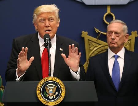 U.S. President Donald Trump dellivers remarks after attending a swearing-in ceremony for Defense Secretary James Mattis (R) at the Pentagon in Washington, U.S., January 27, 2017. REUTERS/Carlos Barria