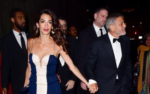 Amal Clooney and George Clooney leave Cipriani 42nd Street on December 5, 2018 in New York City. - Credit: GC images