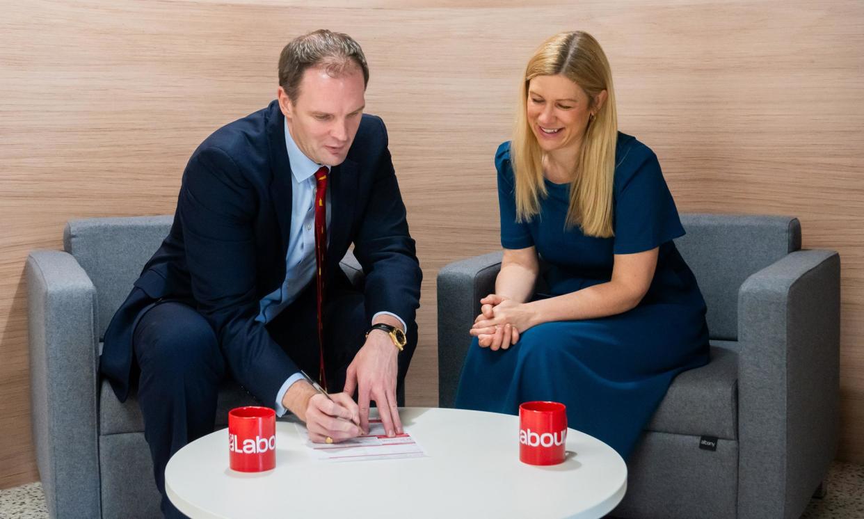 <span>Dr Dan Poulter signing his Labour membership form with Ellie Reeves MP, Labour’s deputy national campaign coordinator on Saturday.</span><span>Photograph: Labour Party</span>