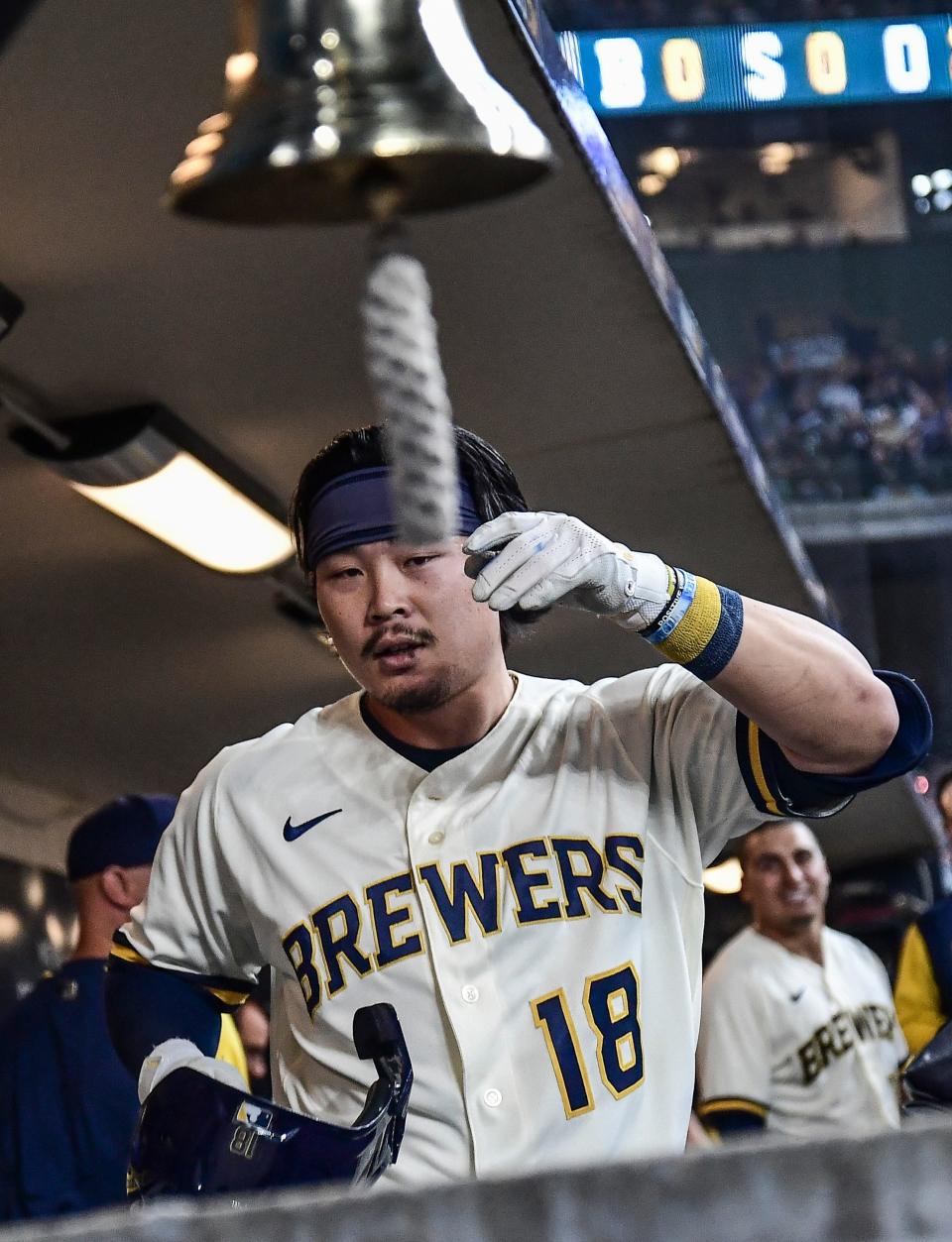 The Brewers' Keston Hiura rings the "Ballplayer Bell" after hitting a solo home run Thursday against the Reds. One day later he was sent to Class AAA Nashville.