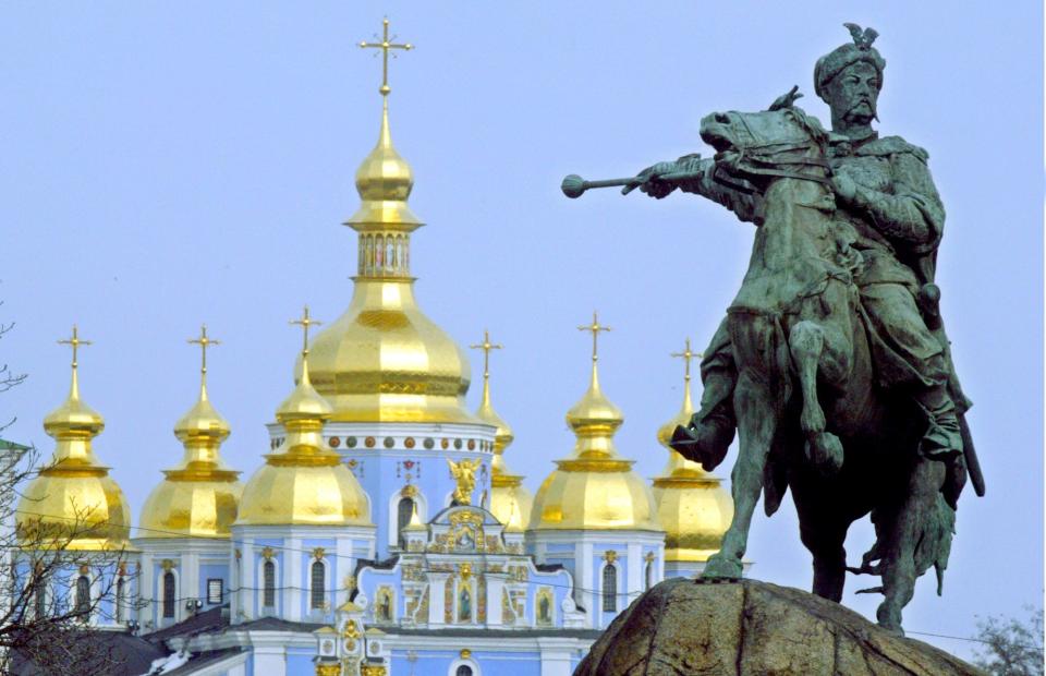 A monument to Bohdan Khmelnytskyi, a central figure in Ukrainian history during the 17th century, sits in Kyiv in 2006, backdropped by St. Michael's Cathedral.