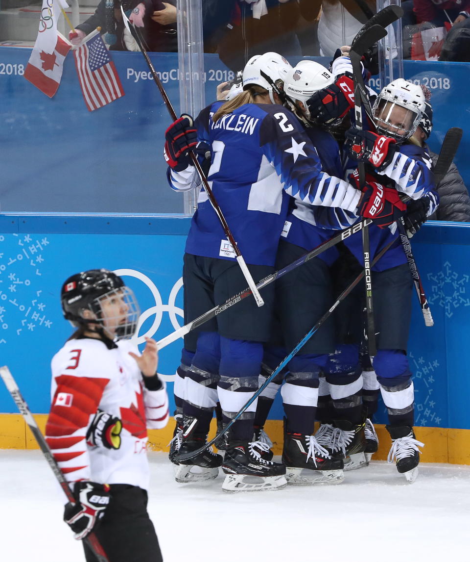 <p>American players celebrate scoring against Canada in the women’s final ice hockey match as part of the 2018 Winter Olympic Games at the Gangneung Hockey Centre. Valery Sharifulin/TASS (Photo by Valery Sharifulin\TASS via Getty Images)the associated </p>