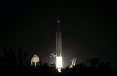 A SpaceX Falcon Heavy rocket, carrying the U.S. Air Force's Space Test Program 2 Mission, lifts off from the Kennedy Space Center in Cape Canaveral, Florida