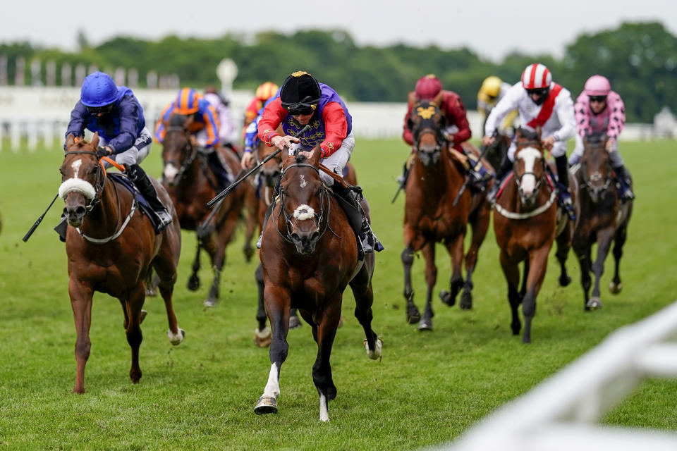 Jockey James Doyle wearing the Queen's silks riding Tactical wins The Windsor Castle Stakes at Royal Ascot