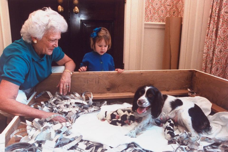 Barbara Bush and her granddaughter, Marshall Lloyd Bush, with her dog Millie and her six newborn puppies.