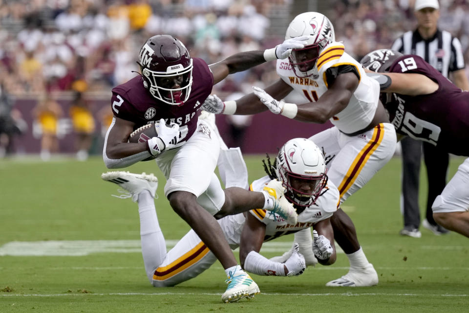 Louisiana-Monroe safety Simion Hines, bottom, trips Texas A&M running back Rueben Owens (2) before Owens can reach the goal line during the first quarter of an NCAA college football game Saturday, Sept. 16, 2023, in College Station, Texas. (AP Photo/Sam Craft)