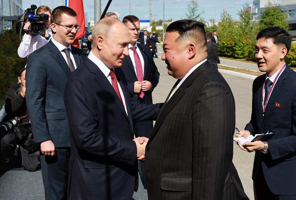 Russian President Vladimir Putin, left, and North Korea's leader Kim Jong Un shake hands during their meeting at the Vostochny cosmodrome, on Sept. 13, 2023.