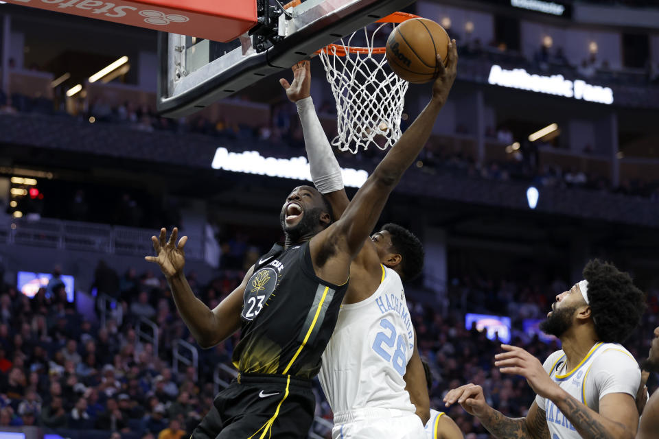 Golden State Warriors forward Draymond Green (23) shoots against Los Angeles Lakers forward Rui Hachimura (28) during the first half of an NBA basketball game in San Francisco, Saturday, Feb. 11, 2023. (AP Photo/Jed Jacobsohn)