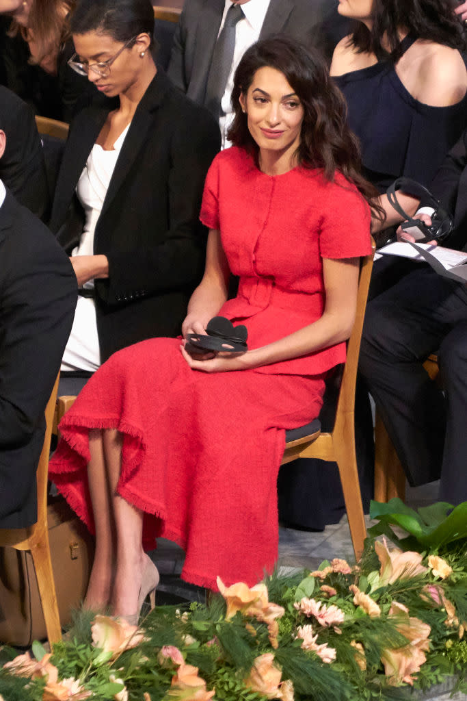 <p>For the Nobel Peace Prize ceremony 2018 in Oslo on December 10, Amal Clooney stood out from the crowd in a red tweed co-ord by Oscar de la Renta. (Getty Images)</p> 