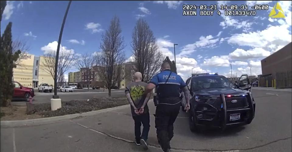 In this photo made from body camera footage and released by the Twin Falls, Idaho, Police Department, Skylar Meade, left, is arrested in Twin Falls on Thursday, March 21, 2024. Police said Meade, an Idaho prison inmate, escaped from custody when an accomplice ambushed corrections officers who were preparing to transport him back to prison from a hospital in Boise on Wednesday, March 20. Authorities say Meade and his accomplice, Nicholas Umphenour, may have been responsible for the killings of two men in northern Idaho while on the run. (Twin Falls Police Department via AP)
