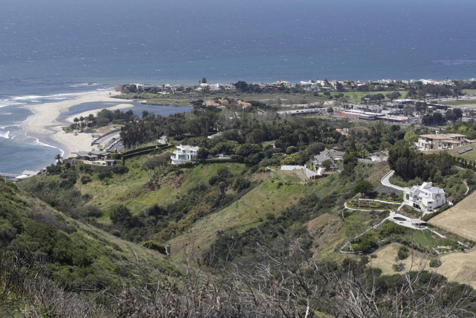 File - In this April 8, 2009, file photo, is an ocean view seen from a hill area adjacent to the proposed Malibu development of U2 guitarist The Edge in Malibu, Calif. A plan by U2 guitarist The Edge to build a cluster of mansions on a ridgeline above Malibu appears dead, after California's highest court declined to consider his last-ditch appeal. The musician, whose real name is David Evans, staged a 14-year legal fight to build five eco-friendly homes dubbed Leaves in the Wind in an undeveloped section of the Santa Monica Mountains west of Los Angeles. The state Supreme Court decided last week not to review a lower court ruling that denied approval to build on the land after the Sierra Club sued to block construction. (AP Photo/Damian Dovarganes, File)