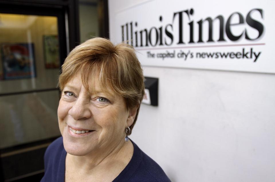 In this photo taken Feb. 24, 2012, Sharon Whalen, Publisher of the Illinois Times, is seen at work in Springfield, Ill. Whalen's small business, a weekly alternative newspaper, got a tax credit to help with cost of providing health care coverage to her employees. As the U.S. Supreme Court prepares to hear arguments on President Barack Obama's health care overhaul, The Associated Press spoke with a variety of people to hear their experiences so far with the landmark legislation, whose major provisions don’t take effect until 2014. Reporters asked: How has the health care law affected your life? As a co-owner of the Illinois Times, a weekly newspaper, Whalen wants to keep her small staff healthy. So she and her business partner provide them with health insurance and pay half the cost of premiums for their 10 employees. Keeping that employee benefit is getting more and more expensive. The company saw a spike in premium costs after one employee’s child had chronic health problems. (AP Photo/Seth Perlman)