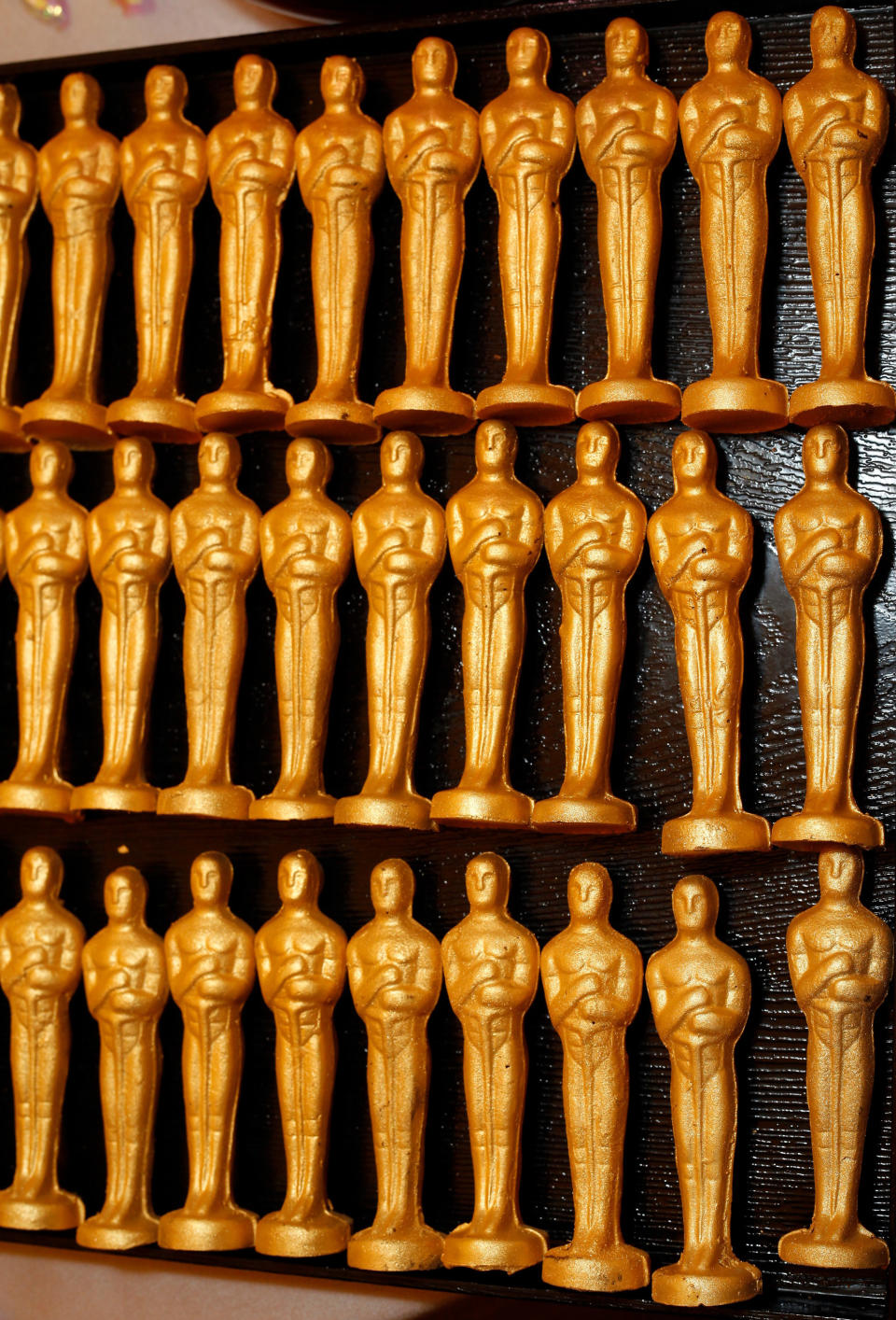 Master Chef Wolfgang Puck's 24 Karat Chocolate Oscars are displayed for the 84th Annual Academy Awards Governors Ball at the Oscar food and beverage preview at the Kodak Theatre in Los Angeles on Thursday, Feb. 23, 2012. (AP Photo/Damian Dovarganes)