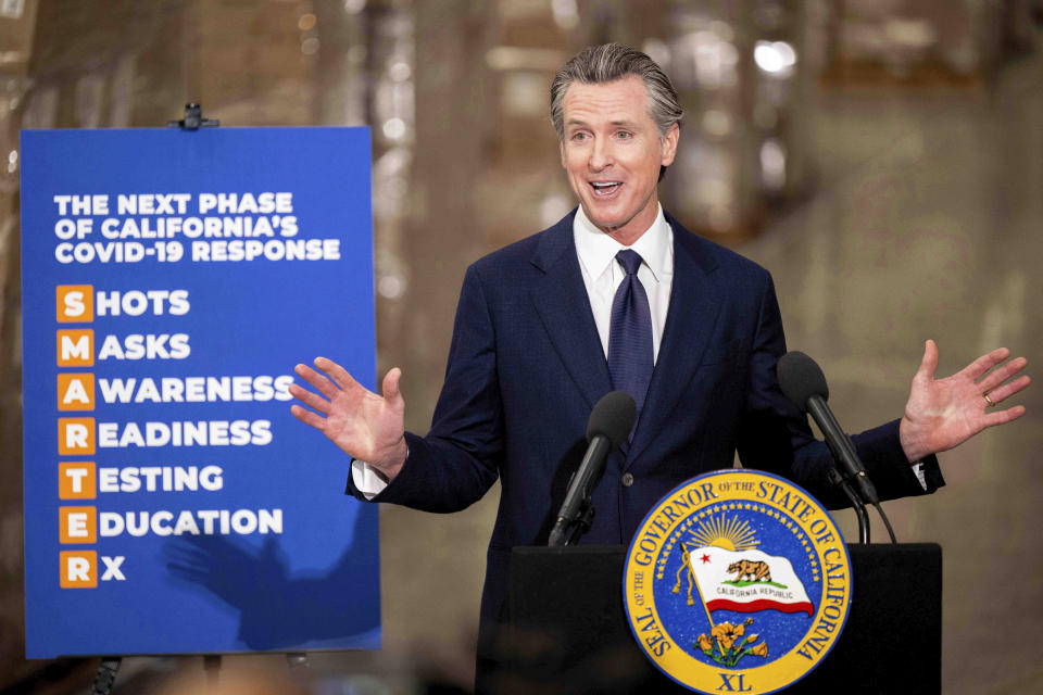 Gov. Gavin Newsom announces the next phase of California's COVID-19 response called "SMARTER," during a press conference at the UPS Healthcare warehouse in Fontana, Calif., on Thursday, Feb. 17, 2022. The plan is to move from the pandemic stage into an endemic stage in which people will learn to live COVID. (Watchara Phomicinda/The Orange County Register/SCNG via AP)