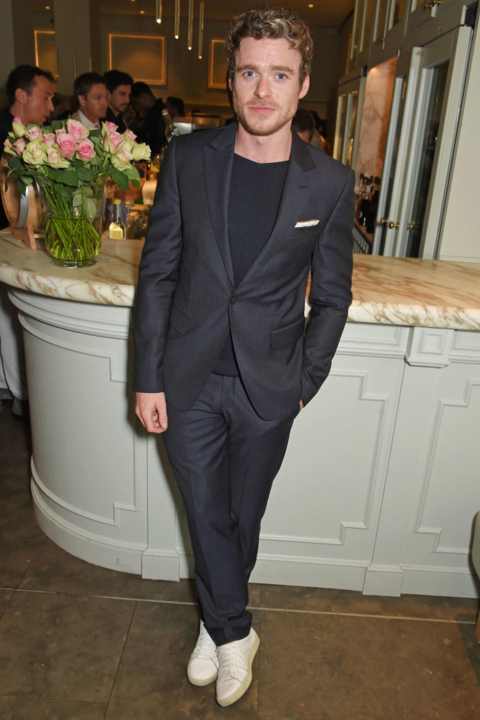 <p><strong>24 July</strong> Richard Madden looked sharp in a simple black suit which he styled with a black t-shirt and cream trainers for the press night. </p>