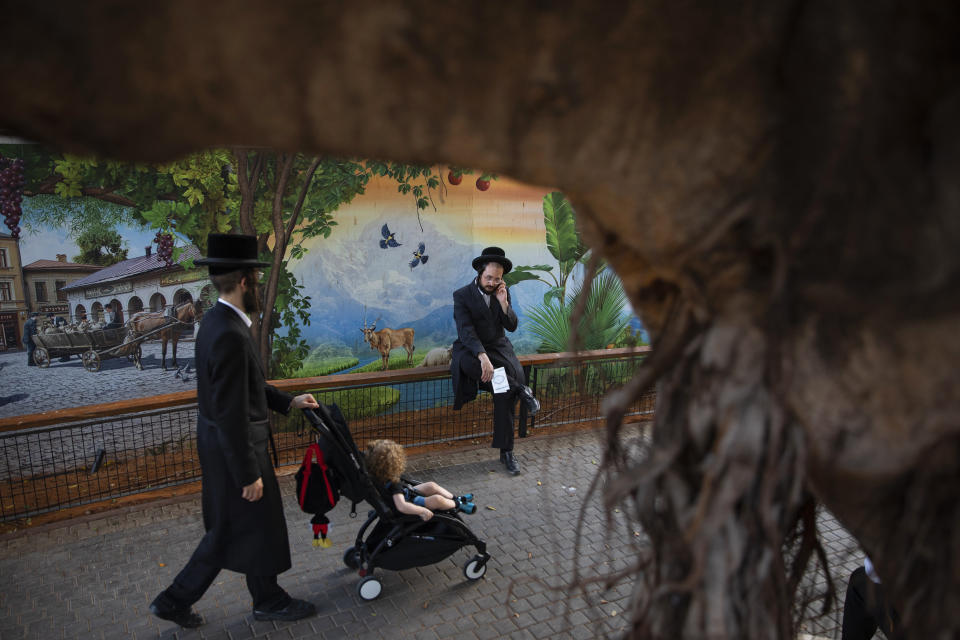 Ultra-Orthodox Jews gather for the Tashlich ceremony, at a zoo in the ultra-Orthodox Israeli town of Bnei Brak, Tuesday, Sept. 14, 2021. Tashlich, which means 'to cast away' in Hebrew, is the practice by which Jews go to a large flowing body of water and symbolically 'throw away' their sins by throwing a piece of bread, or similar food, into the water before the Jewish holiday of Yom Kippur, the holiest day in the Jewish year which starts at sundown Wednesday. (AP Photo/Oded Balilty)