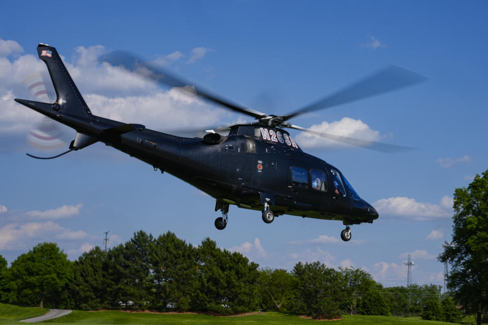 Kyle Larson leaves on a helicopter heading to the NASCAR All-Star race after qualifying for the Indianapolis 500 auto race at Indianapolis Motor Speedway in Indianapolis, Sunday, May 19, 2024. (AP Photo/Michael Conroy)