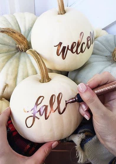 Make everyone know that they are welcome to knock on your door for a spot of trick or treating by leaving out a chic welcome sign.