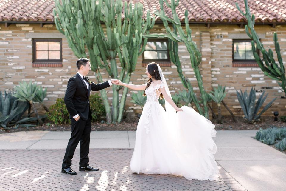 A couple celebrates their wedding at Estancia La Jolla Hotel & Spa in the San Diego area.