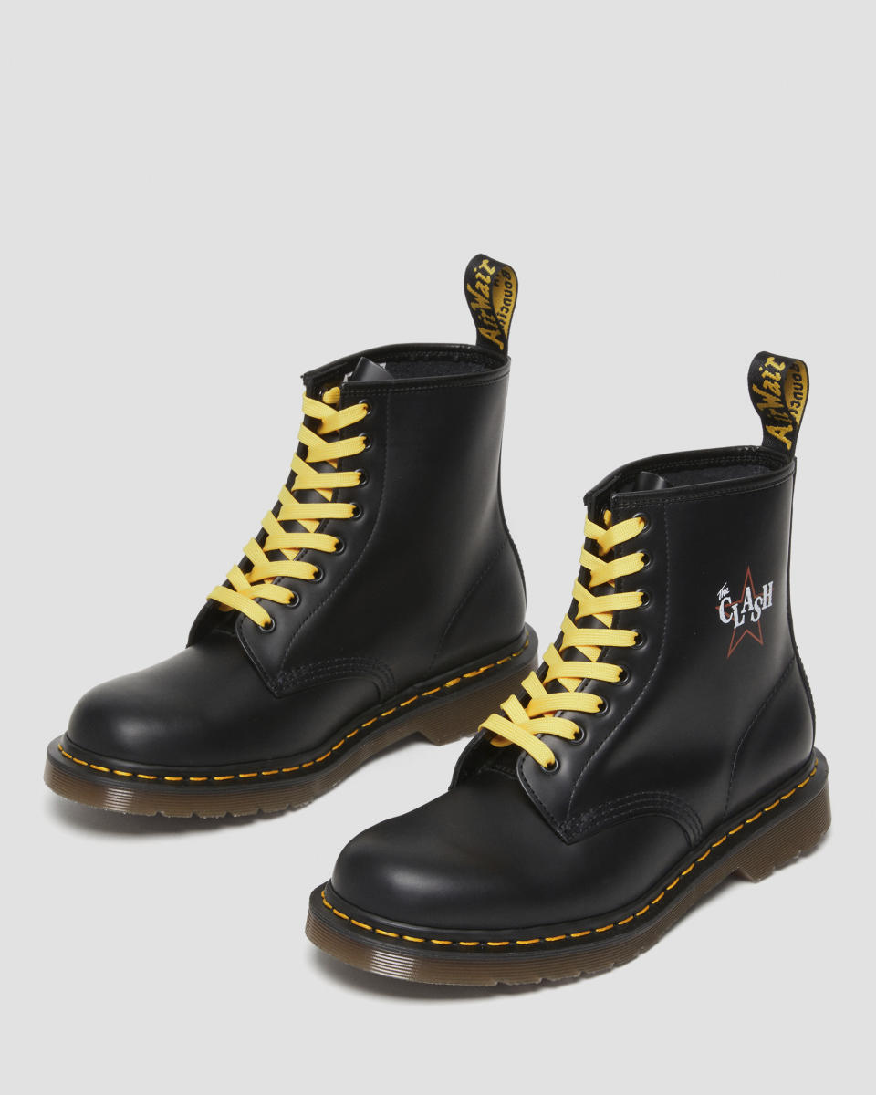 This image released by Doc Martens shows promotional art for a line of shoes, a collaboration between the iconic shoe maker and punk band The Clash. The heels are marked with The Clash’s logo and each pair comes equipped with a set of dog tags based on those worn by the band and seven sets of laces inspired by the colors of their most iconic albums. (Doc Martens via AP)