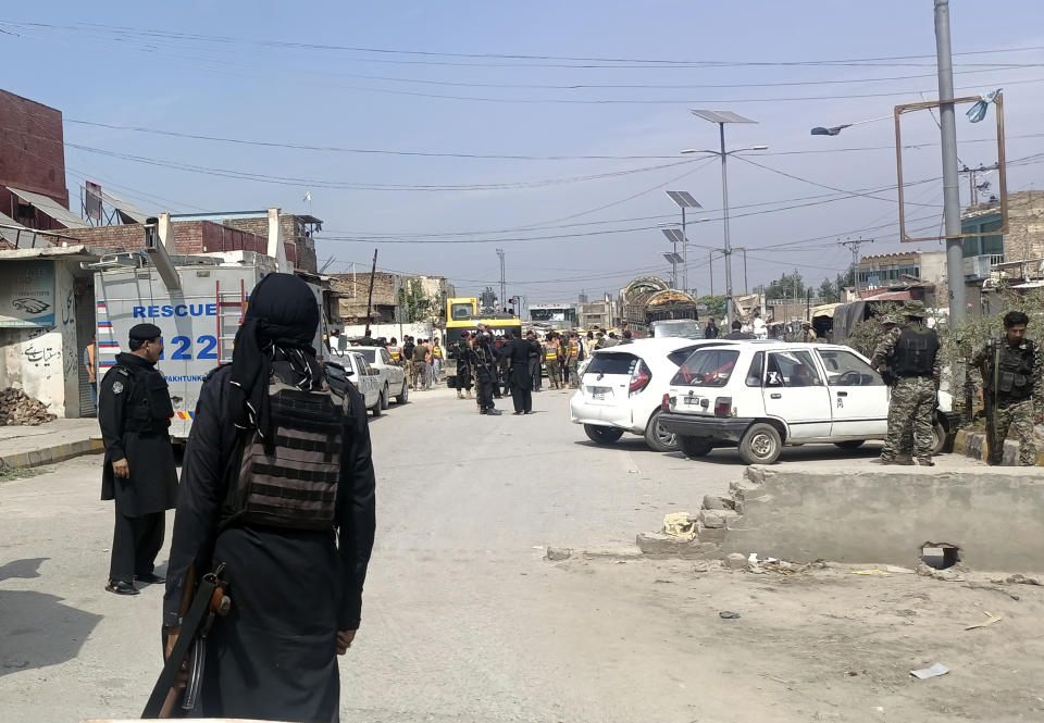 Security members arrive at the site of a suicide bombing attack in the police compound in the Bara Khyber Pakhtunkhwa, Pakistan, Thursday, July 20, 2023. Suicide bombers attacked a sprawling compound housing a police station and government offices in northwest Pakistan on Thursday, killing at least two police officers and wounding over a dozen other people, police and rescue officials said. (AP Photo/Qazi Rauf)