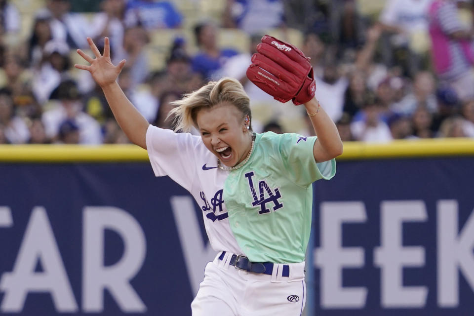 Jojo Siwa reacts after missing a fly ball during the MLB All Star Celebrity Softball game, Saturday, July 16, 2022, in Los Angeles. (AP Photo/Mark J. Terrill)