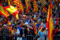 <p>People wave Spanish flags during a pro-unity demonstration in Barcelona on Oct. 29, 2017. (Photo: Lluis Gene/AFP/Getty Images) </p>