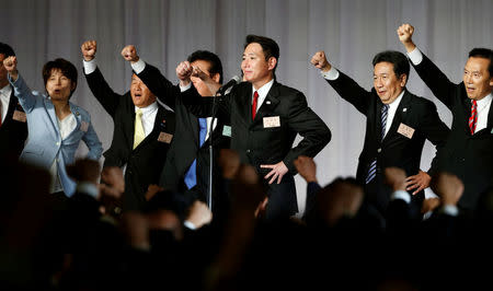 Japan's former Foreign Minister Seiji Maehara raises his fists with his party lawmakers after he was elected as the leader of Japan's main opposition party, the Democratic Party, during the party plenary meeting in Tokyo, Japan September 1, 2017. REUTERS/Toru Hanai