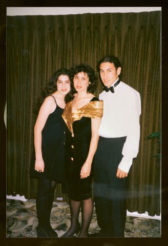 <p>Courtesy Estate of Amy Winehouse</p> Amy Winehouse as a teenager with her mom Janis and brother Alex
