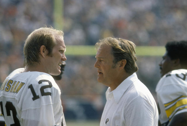 Pittsburgh Steelers QB Terry Bradshaw on field, being tended to by