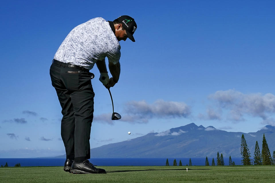 Patrick Reed plays his shot from the first tee during the second round of the Tournament of Champions golf event, Friday, Jan. 7, 2022, at Kapalua Plantation Course in Kapalua, Hawaii. (AP Photo/Matt York)