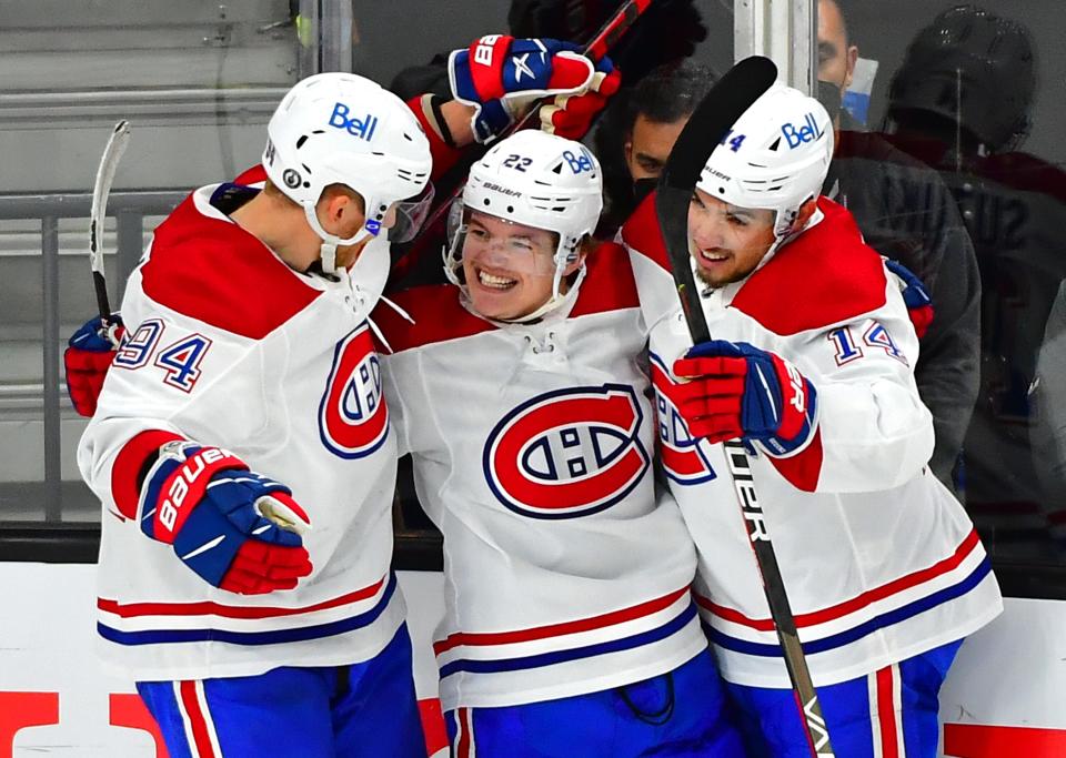 Canadiens right wing Cole Caufield (center) celebrates with teammates Corey Perry (94) and Nick Suzuki after scoring a second-period goal.